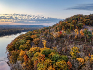 glaciated hill country of southwestern Wisconsin sunset river with sky reflection trees changing color in the fall