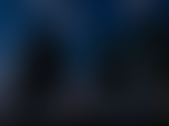 A father and daughter, holding hands, gaze at a starry sky beside a lake. One points upwards. Trees frame the scene, creating a peaceful nighttime mood.