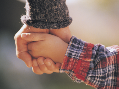 Father and son holding hands