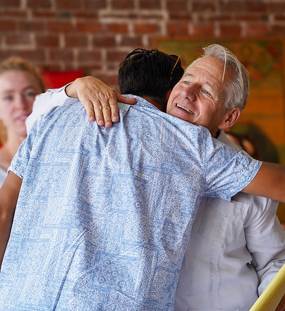 Tom hugging a SMC event guest
