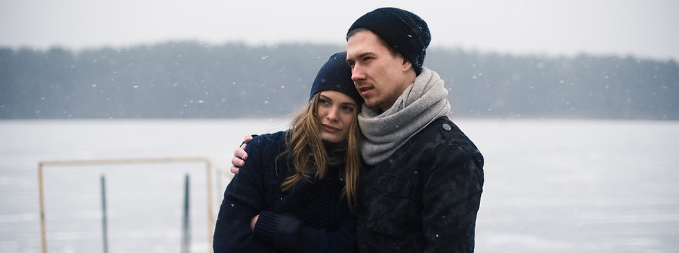Couple Hugging on a Pier