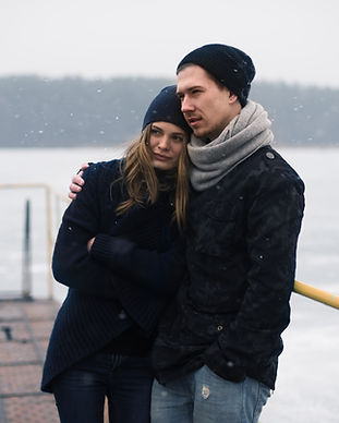 Couple Hugging on a Pier