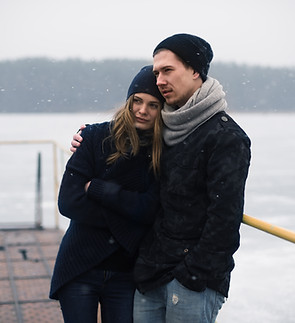 Couple Hugging on a Pier