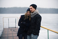 Couple Hugging on a Pier