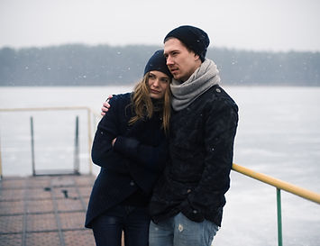 Couple Hugging on a Pier