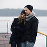 Couple Hugging on a Pier