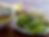 A plate of fresh Vietnamese herbs and vegetables, served with dipping sauces.