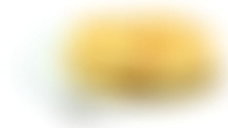 Stack of golden Italian flatbread Piadina with charred spots from griddle cooking on white ceramic plate