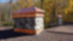 Stone chimney with copper caps