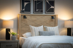 real estate photography detail of bedroom at 5512 Dansby Place with soft lighting and cozy design elements