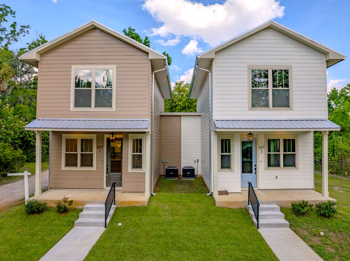 professional real estate photography of southern-modern duplex in Smokey Hollow Tallahassee with quartz countertops, metal roof, and cement fiber siding near Cascades Parkprofessional real estate photography