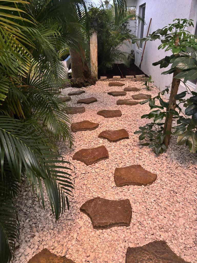Stepping stone path using tile installation techniques.