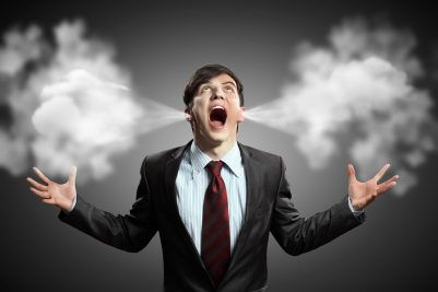 businessman in anger screaming puff going out from ears
