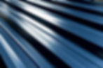 Blue metallic roof tiles background with drops of water..jpg