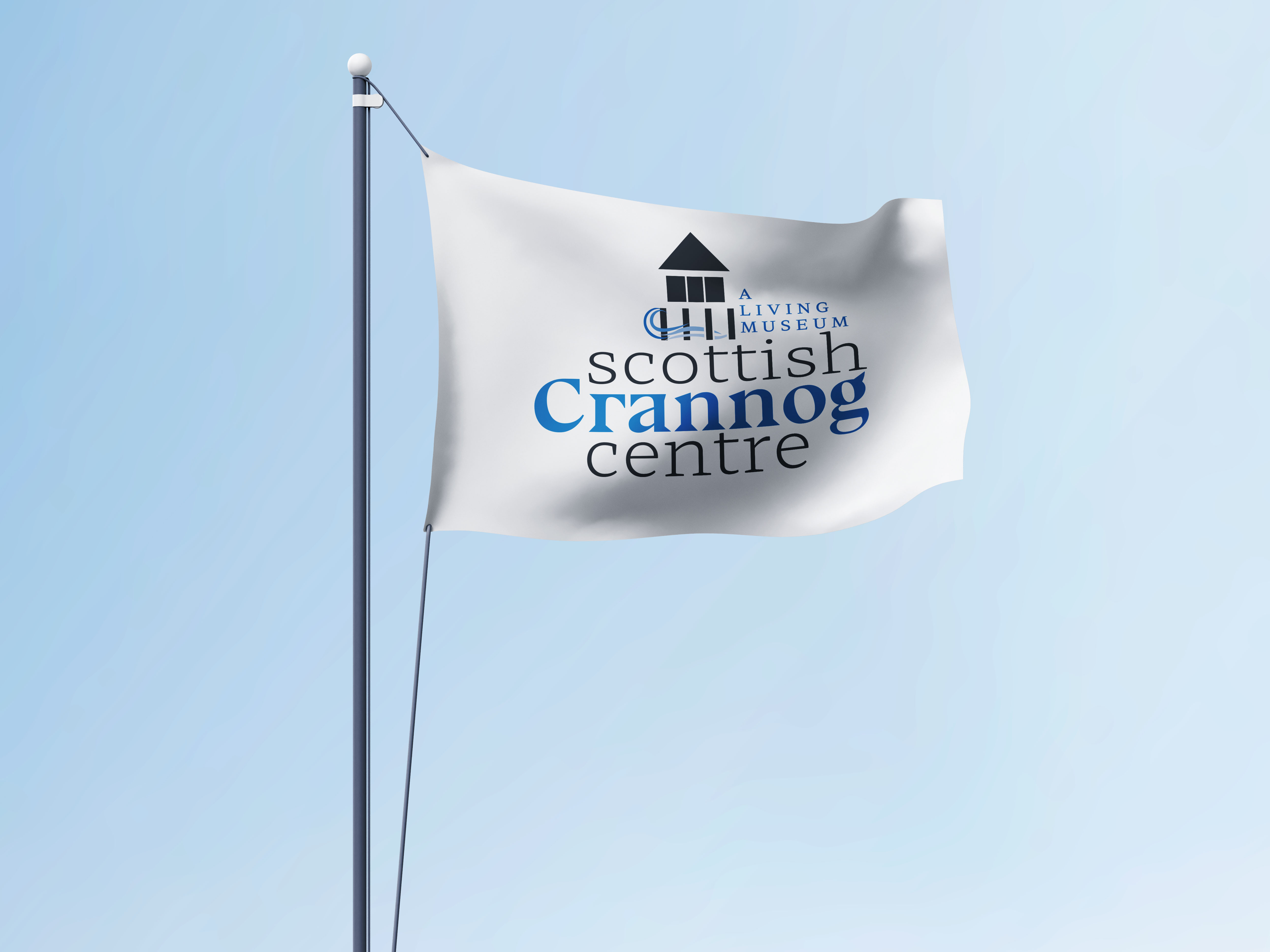 white flag blowing in wind with scottish crannog centre logo printed on 