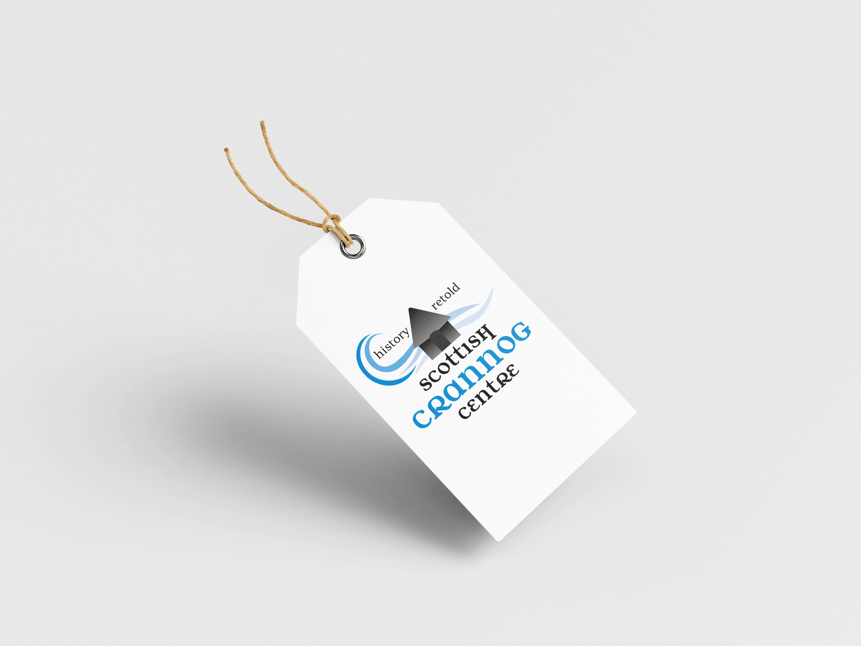 clothes or product tag white and blue with crannog imagery 