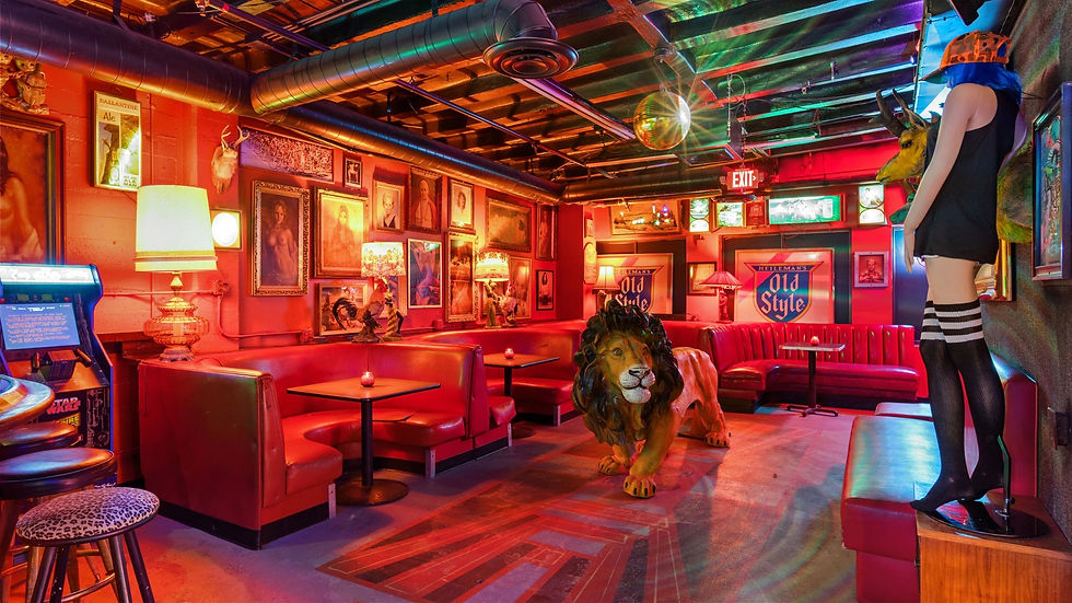 Uncle Ollie’s Penthouse area shows a stylish interior with a bold tiger artwork, giving the space a dramatic, upscale vibe.