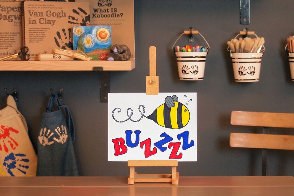 finished Onomatopoeia Art that Pops craft on easel in Art to Know with MommyO vlog set