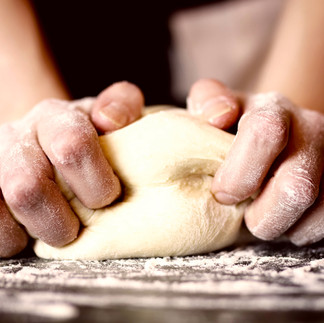fingers kneading bread dough as a creative outlet