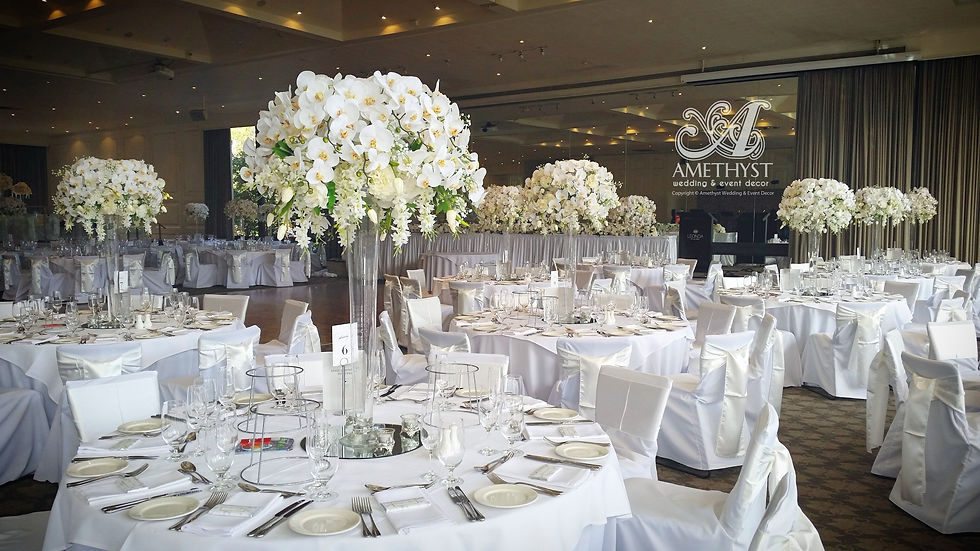 Thumbnail: Melbourne Wedding Decor Hire - White Orchid Floral Arrangement