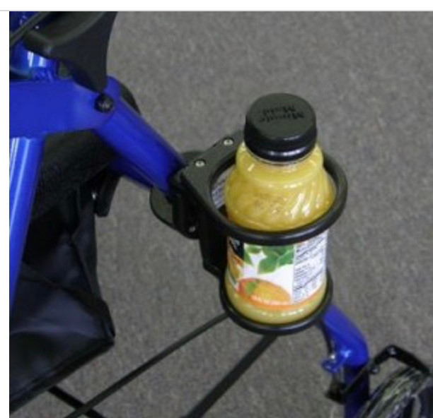 a cup holder on a walker with a bottle of orange juice