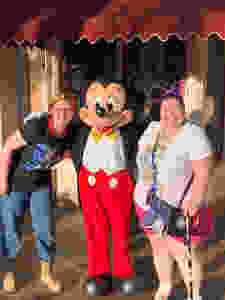 2 woman and Mickey Mouse
