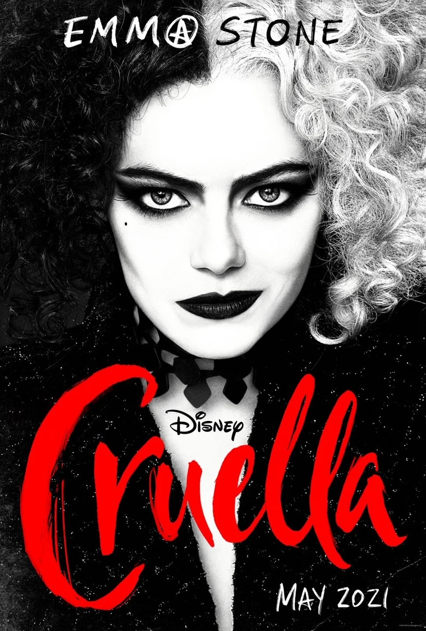 wpman with half white hair, half black hair wearing black with writing Disney's Cruella May 2021