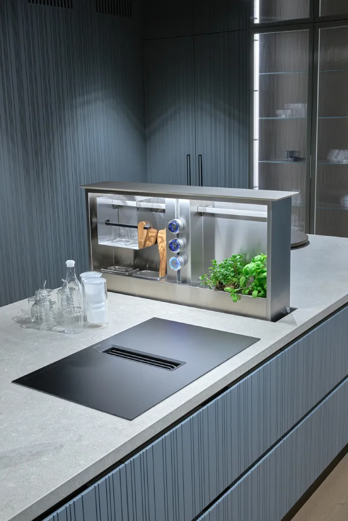 Matte countertop material with integrated sink and minimalist European kitchen cabinetry.
