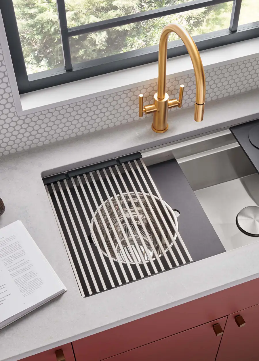 Kitchen workstation sink with integrated cutting board, drying rack, and colander accessories
