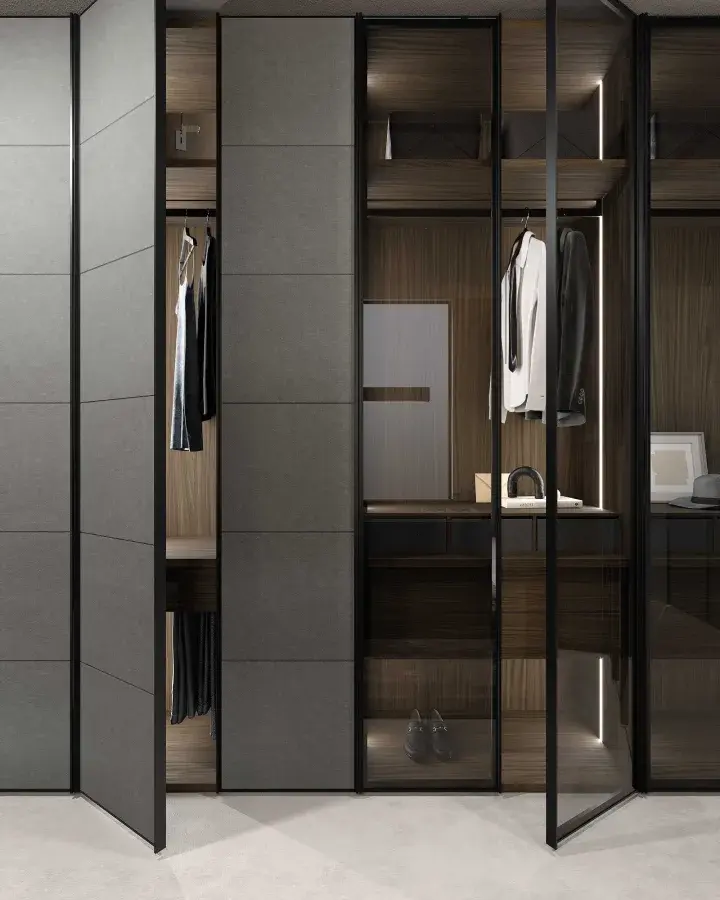 Luxury walk-in closet from GF Interiors SHINE collection featuring aluminum frame glass wardrobe doors, eco-leather panels, and integrated LED lighting in an Italian custom wardrobe system.
