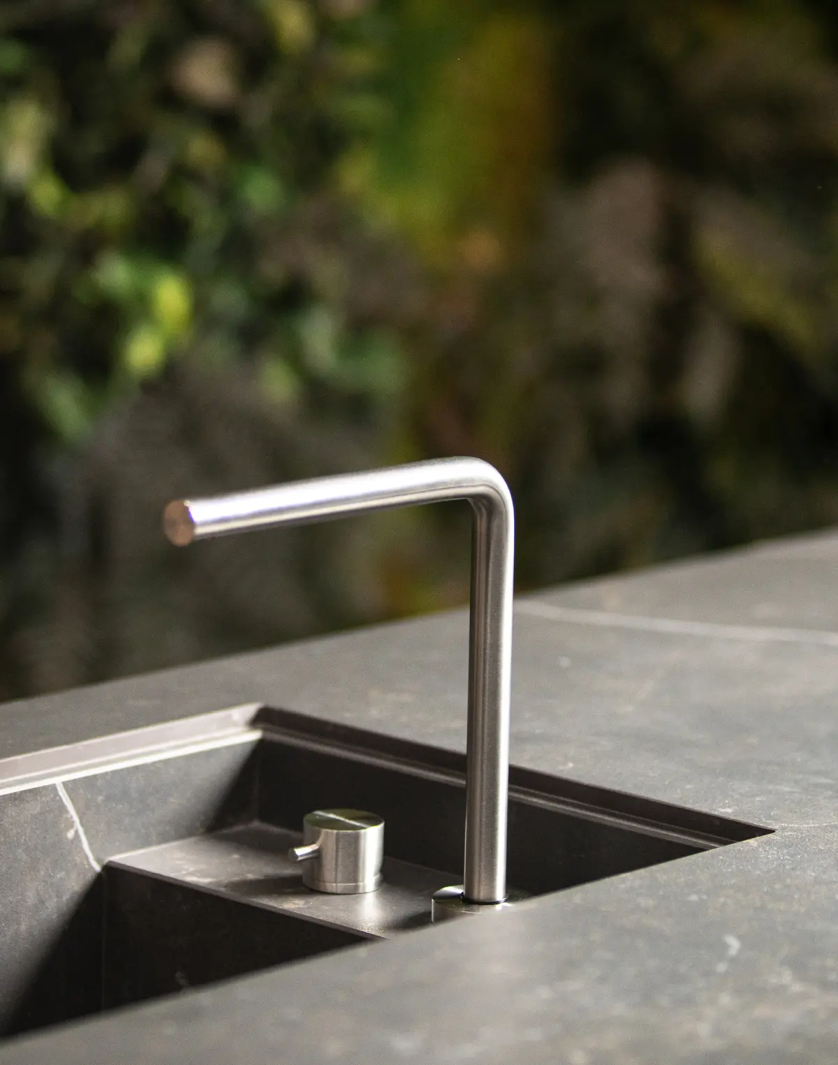 TM Italia AERA outdoor kitchen sink detail with integrated outdoor worktop and modern European styling.