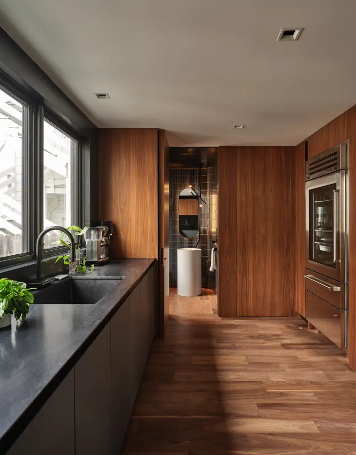 Luxury kitchen with continuous flooring beneath cabinets allowing easy dishwasher and refrigerator replacement.