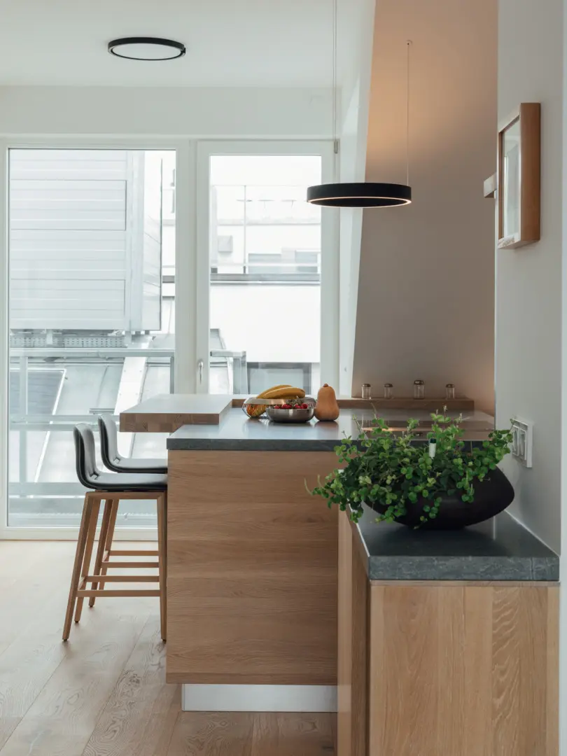 biophilic kitchen ideas showing natural wood surfaces, indoor plants, and nature-inspired design details.