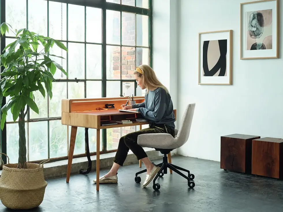 TEAM 7 Sol secretary solid wood writing desk with ergonomic chair in a modern home office workspace.