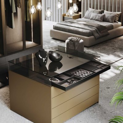 Luxury walk-in closet island from GF Interiors Naked with Evans and Always collection featuring glass top display, integrated jewelry drawers, and Italian custom wardrobe design.