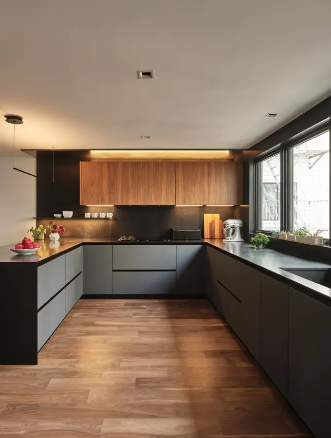 Luxury kitchen with continuous flooring beneath cabinets allowing easy dishwasher and refrigerator replacement.