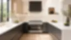 Contemporary luxury kitchen featuring integrated ventilation, charcoal cabinetry, and premium European finishes.