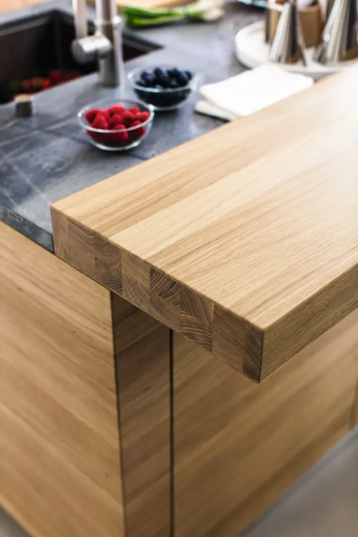 biophilic kitchen ideas showing natural wood surfaces, indoor plants, and nature-inspired design details.