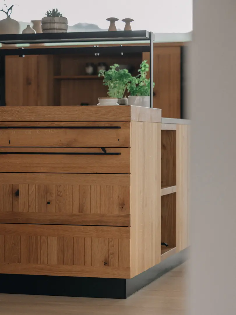 Close-up of TEAM 7 solid wood kitchen cabinetry showcasing natural grain, texture, and handcrafted craftsmanship.