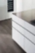 White handleless kitchen cabinets with T30 recessed groove and modern minimalist design