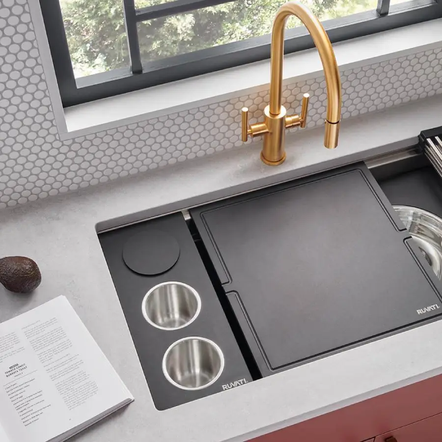 Kitchen workstation sink with integrated cutting board, drying rack, and colander accessories