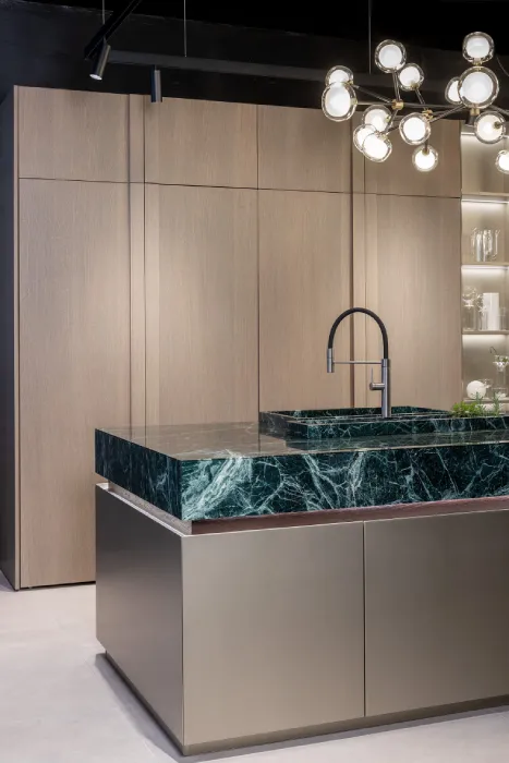 Pocket cabinet doors opening to reveal hidden storage in a luxury European kitchen