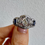Thumbnail: 18kt White Gold Art Deco Filigree Diamond And Sapphire Ring