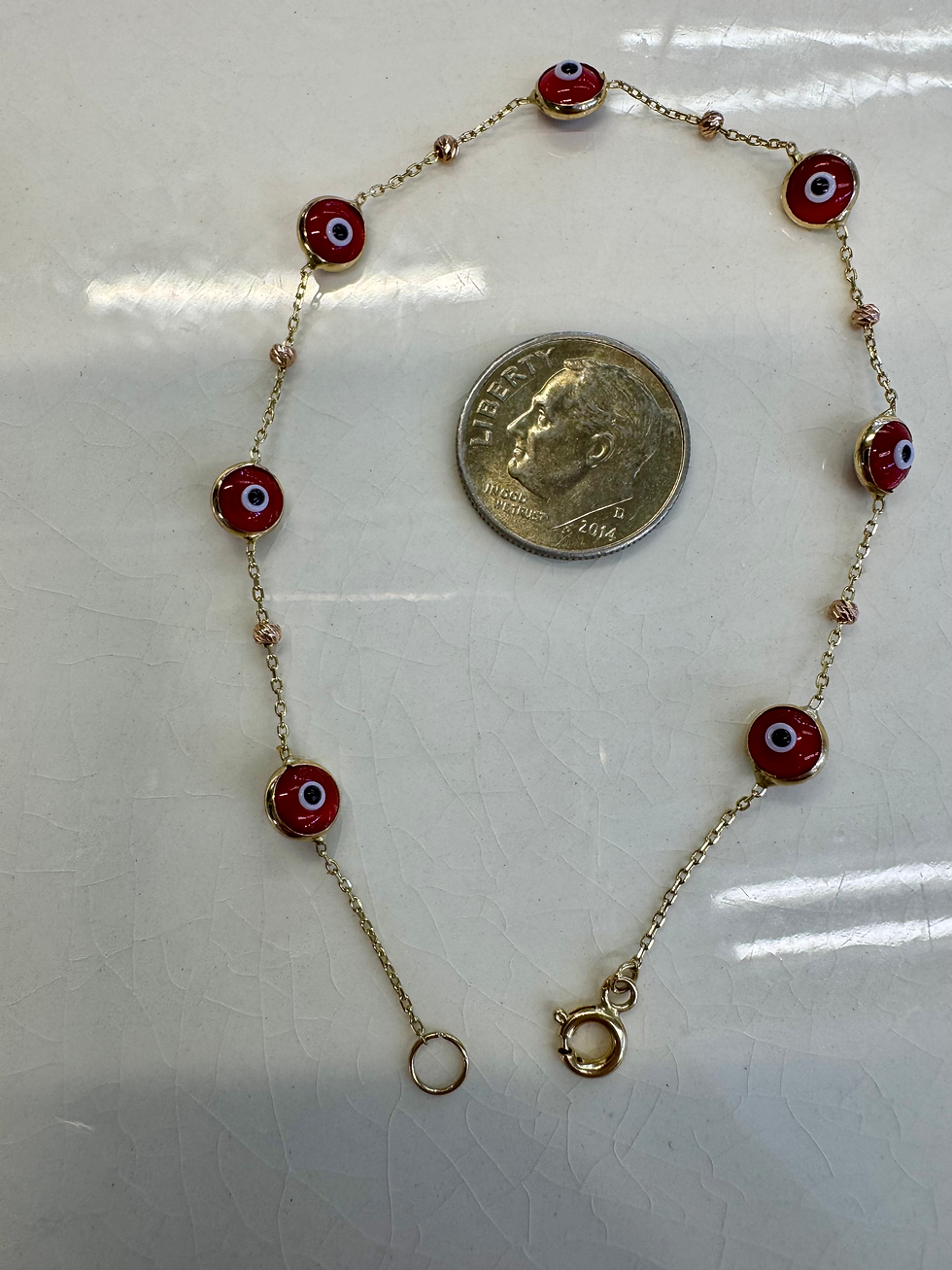 Thumbnail: Set Of Three 14kt Yellow Gold Hamsa And Evil Eye Bracelets