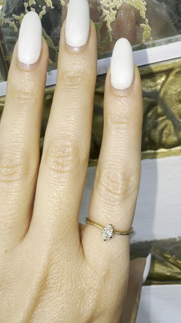 Thumbnail: Dainty 14kt Yellow Gold Marquise Shape Diamond Wavy Solitaire Ring