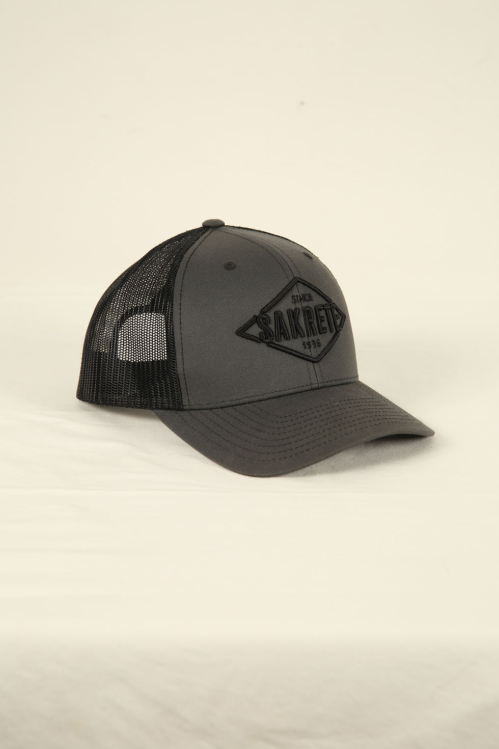 Grey and black cap with embroidered Sakrete logo