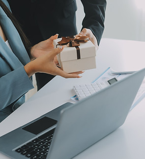 young-businessman-giving-his-colleague-present-office-young-man-surprise-beautiful-busines