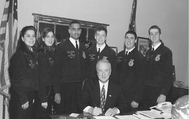 NC FFA state officers from the 1990s with an adult