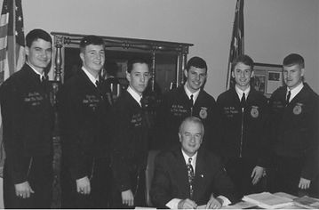 NC FFA state officers 1990s with a seated man