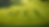 Golf course with "OTT" neatly cut into bright green grass. Rolling fairway and trees in the background create a serene, sunny setting.